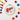 Cross-stitch hoop with colorful plaid pattern and 'Tiree' text, surrounded by embroidery threads on a white background.